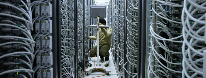 Data Resilience in a server room and a technician.