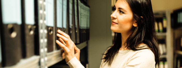 woman working on creating data archiving strategy